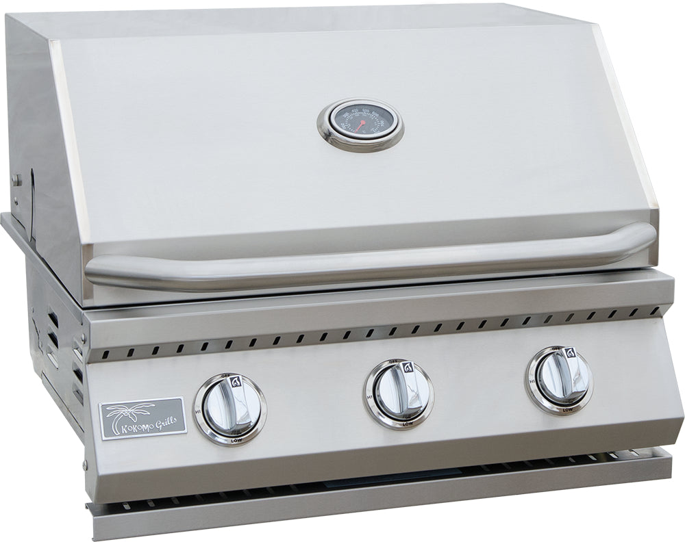 Stainless steel grill with three control knobs on a white background