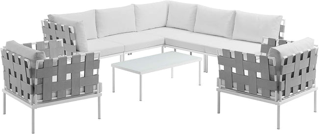 Gray outdoor sectional sofa set with matching chairs and coffee table on a white background