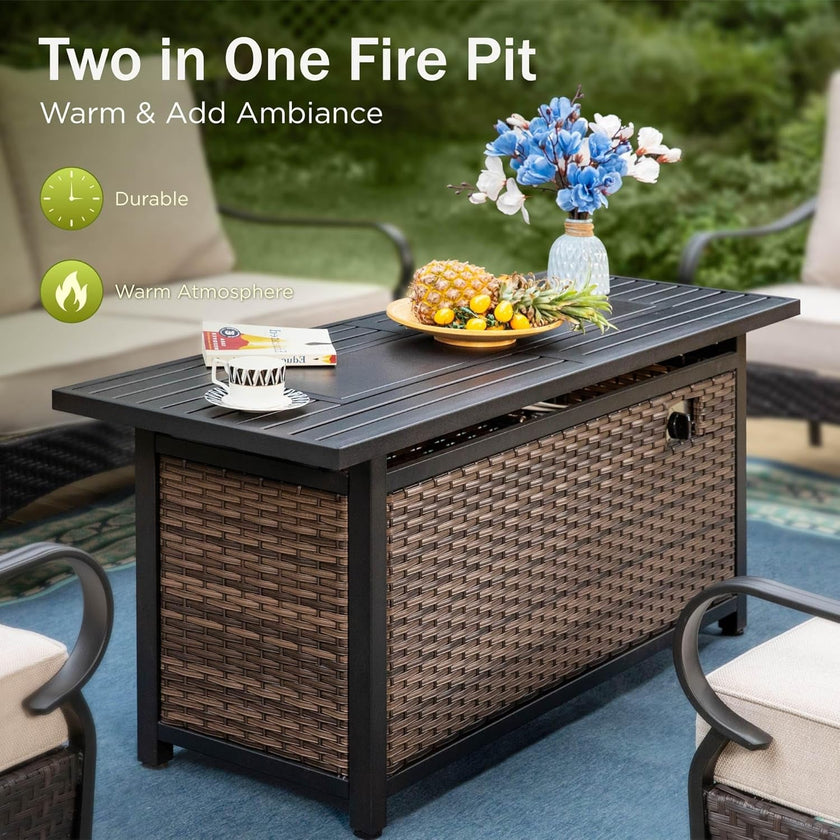 Outdoor coffee table with wicker storage compartment and decorative items on a white background