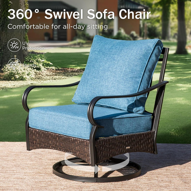 360-degree swivel sofa chair with blue cushions on a patio, surrounded by greenery.