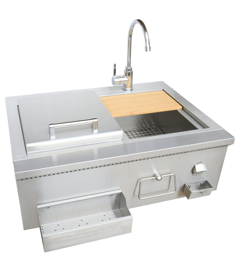 Stainless steel kitchen sink with faucet and wooden cutting board on a white background