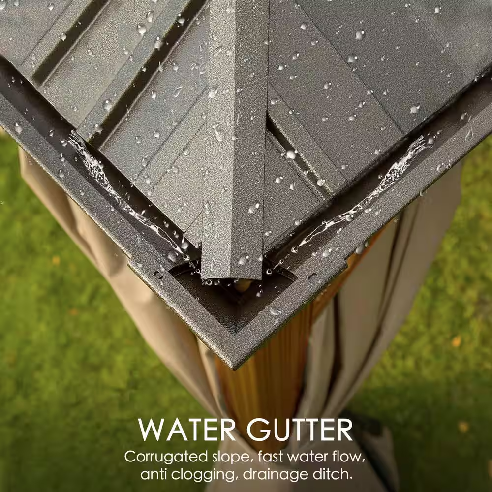Close-up of a water gutter system with rainwater flowing, on a blurred green grass background.