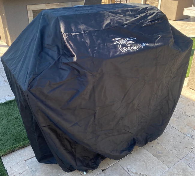 Black grill cover with a logo on a patio