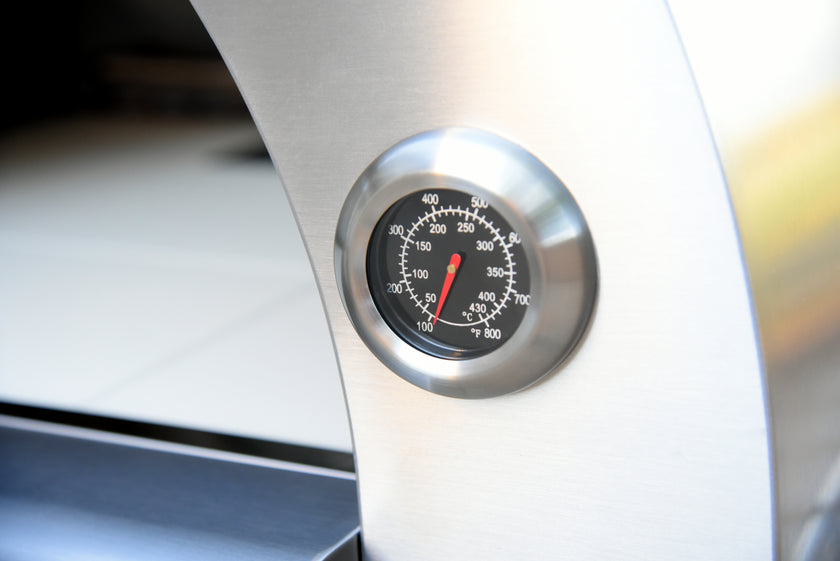 Thermometer on a metallic surface with blurred background