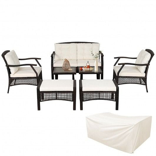 Outdoor furniture set with black frames and white cushions on a white background