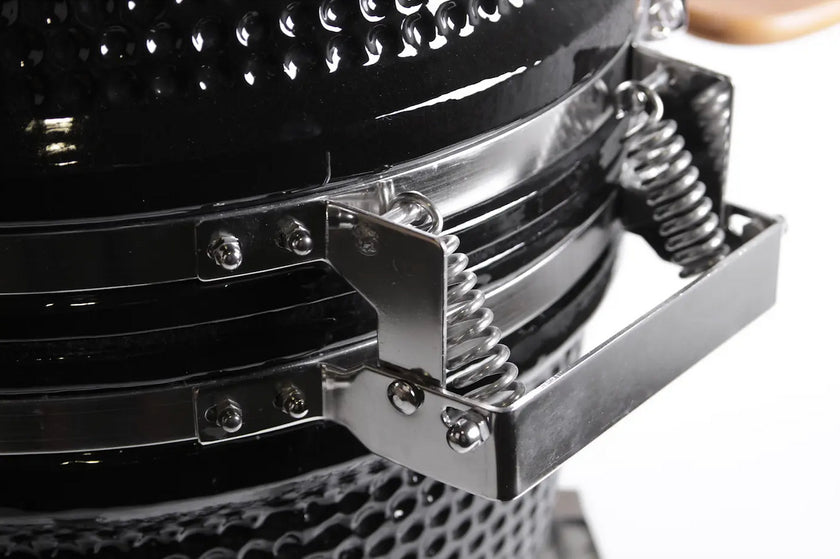 Close-up of a metallic object with springs and a spring-loaded mechanism