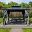 Outdoor gazebo with curtains and a dining table set on a grassy area.
