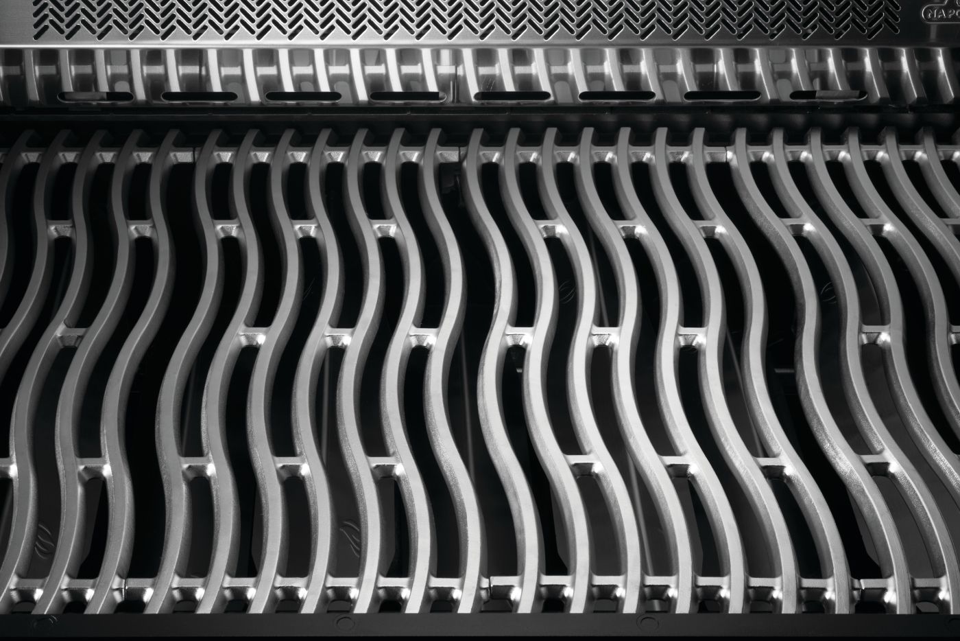 Close-up of a metallic grid with wavy pattern