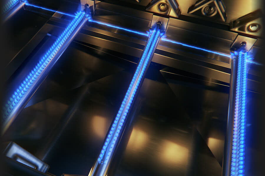 Close-up of a metallic structure with blue LED lights on a dark background