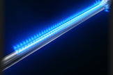 Blue LED strip light on a dark background