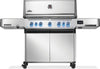 Stainless steel grill with multiple burners on a white background