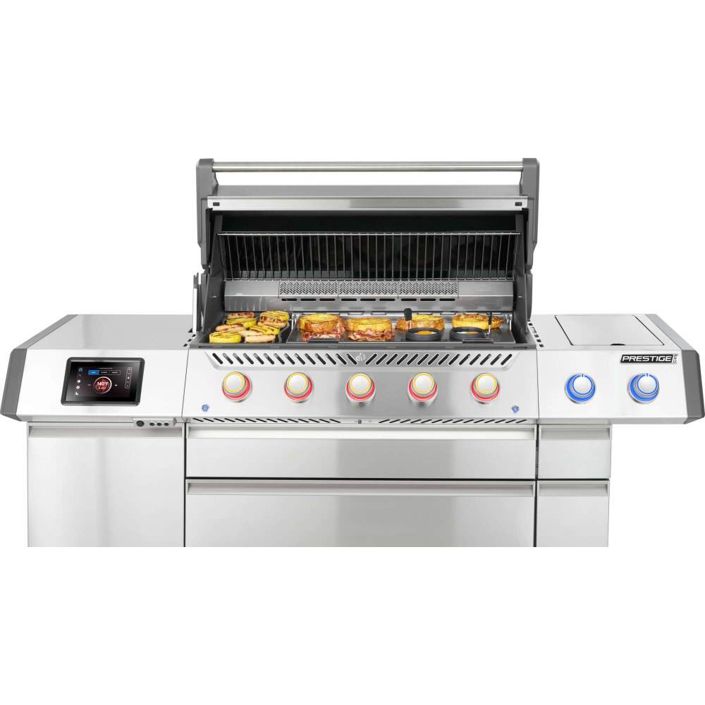 Stainless steel grill with digital display and control knobs on a white background