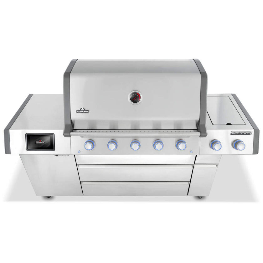 Stainless steel grill with multiple control knobs on a white background