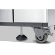 Close-up of a metal cabinet with wheels on a white background