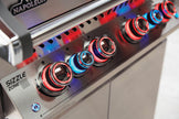 Close-up of a Napoleon grill with 'Sizzle Zone' control knobs.