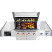 Stainless steel grill with food on a white background