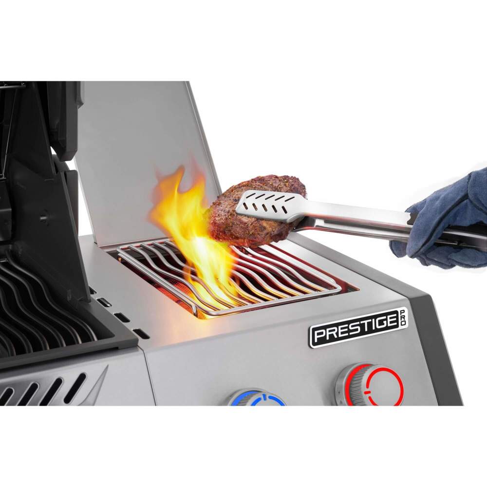Grilling a steak on a Prestige grill with flames