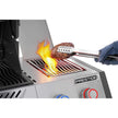 Grilling a steak on a Prestige grill with flames