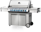 Stainless steel grill with multiple burners on a white background