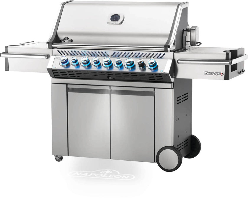 Stainless steel grill with multiple burners on a white background