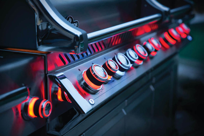 Close-up of a grill with glowing red and orange elements