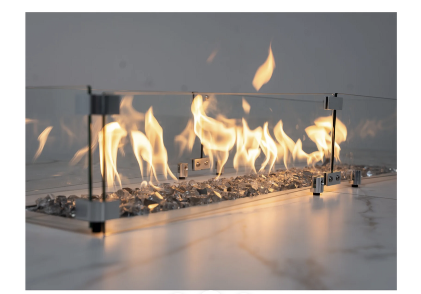 Modern ethanol fireplace with glass front and visible flames on a light background
