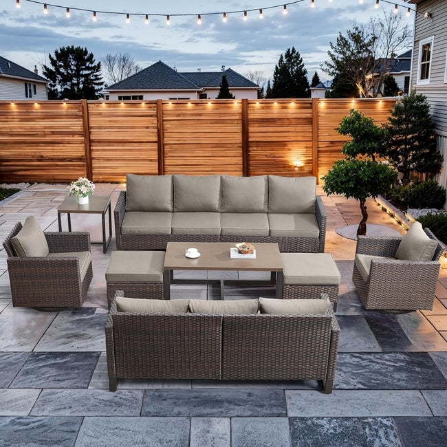 Outdoor patio set with furniture on a stone patio area.