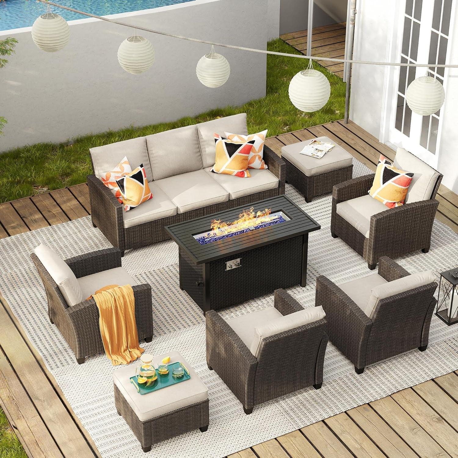 Outdoor patio set with fire pit table on a wooden deck