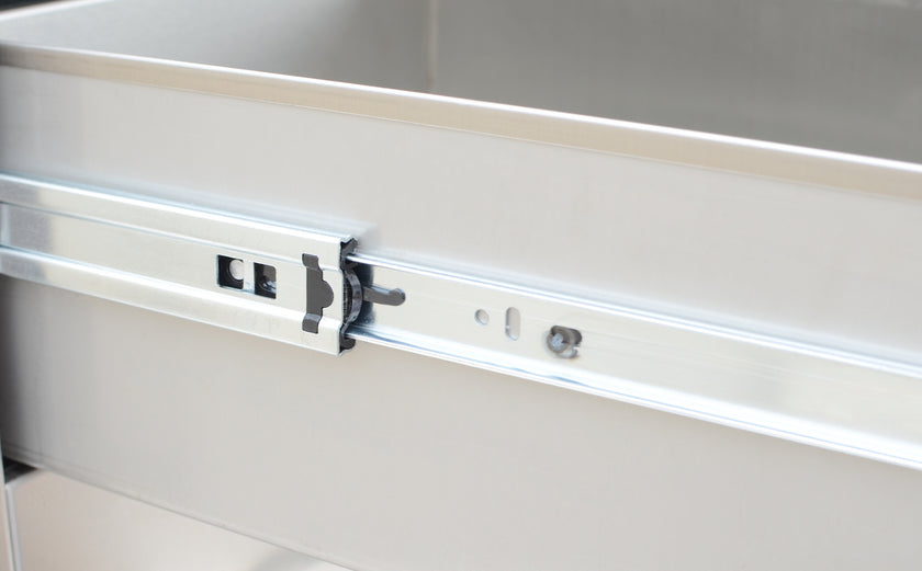 Metal drawer slide mechanism on a metallic surface