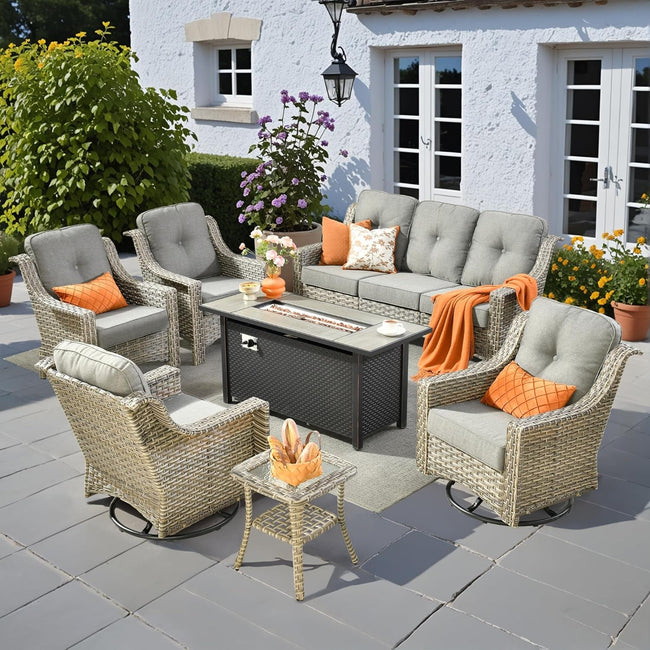 Outdoor patio set with furniture and decor in front of a house.