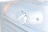 Control knob on a white appliance with numbers