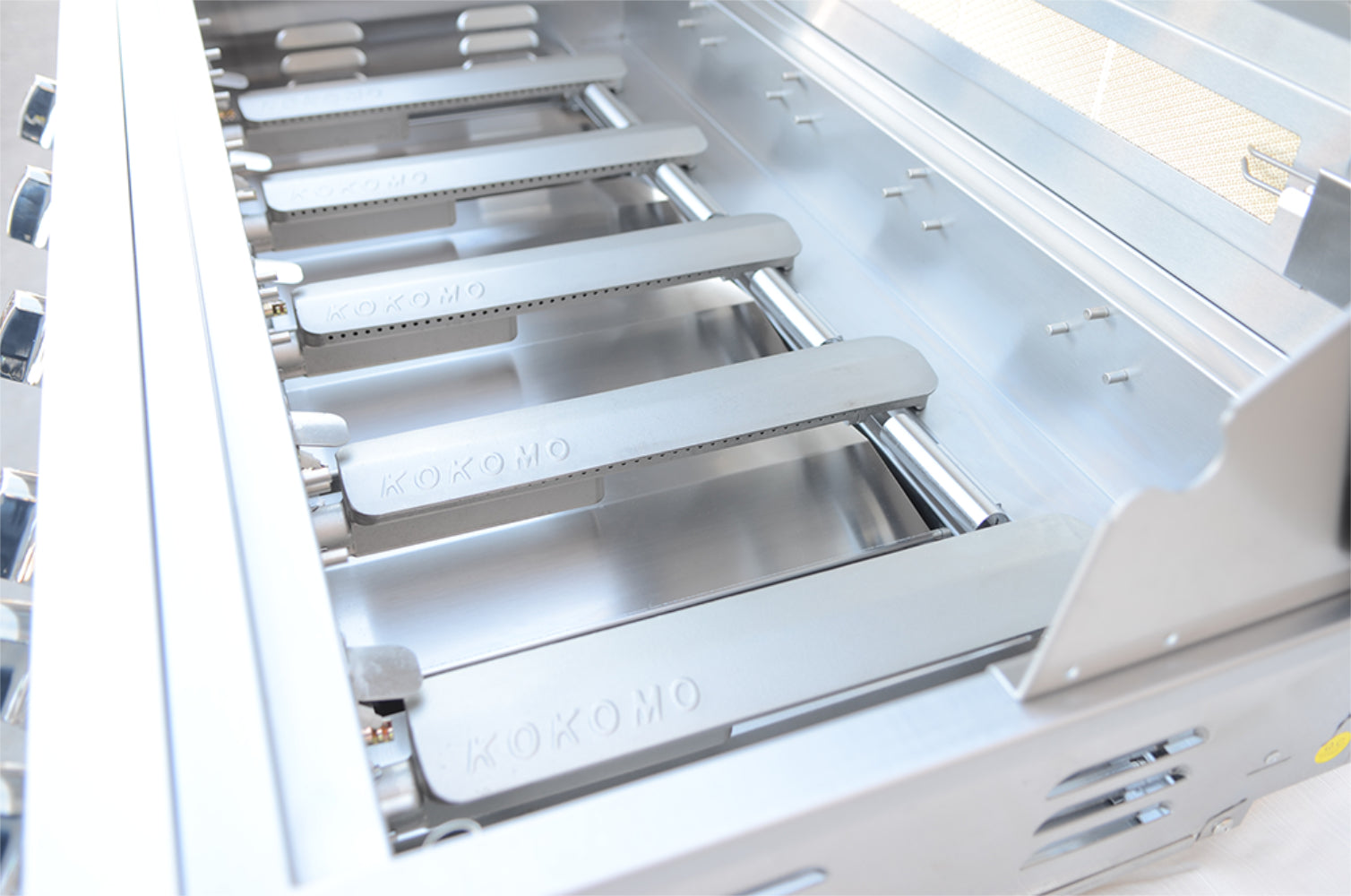 Close-up of a kitchen appliance with metallic shelves and 'Bosch' branding.